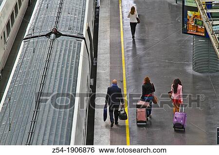 Stock Photograph - Passangers at Atocha railway station, Madrid, Spain. Fotosearch