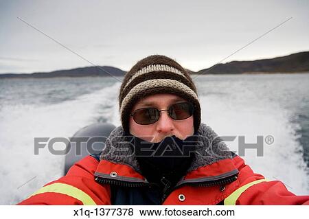 Passenger on a speedboat self portrait, South Greenland View Large Photo Image Stock Photo - Passenger on a speedboat self portrait, South Greenland. Fotosearch