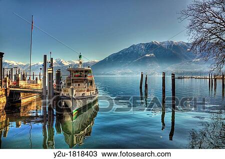 Passenger ship on an alpine lake with snow-capped mountain View Large Photo Image Stock Image - Passenger ship on an alpine lake with snow-capped mountain. Fotosearch