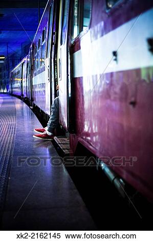 Passenger with red shoes waiting for train departure in Antwerp Centraal Station, Belgium View Large Photo Image Stock Photography - Passenger with red shoes waiting for train departure in Antwerp Centraal Station, Belgium. Fotosearch