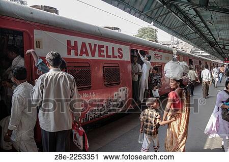 Passengers boarding a local train on Dadar station in Mumbai (Bombay), Maharashtra, India. View Large Photo Image Stock Image - Passengers boarding a local train on Dadar station in Mumbai (Bombay), Maharashtra, India.. Fotosearch