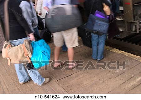 Picture - Passengers boarding a train.. Fotosearch