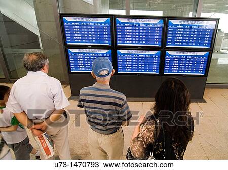 Passengers checking the new schedule of the CRH bullet trains heading to Beijing and Shanghai. View Large Photo Image Stock Image - Passengers checking the new schedule of the CRH bullet trains heading to Beijing and Shanghai.. Fotosearch