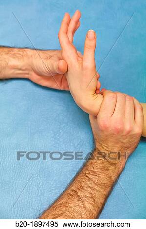 Passive mobilization of wrist flexion Physiotherapy medical center, Donostia, San Sebastian, Gipuzkoa, Basque Country, Spain View Large Photo Image Stock Photography - Passive mobilization of wrist flexion Physiotherapy medical center, Donostia, San Sebastian, Gipuzkoa, Basque Country, Spain. Fotosearch