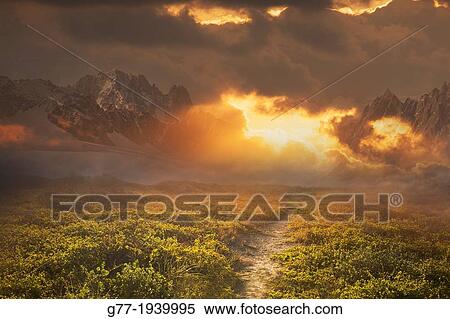Path to a mountain range at sunset View Large Photo Image Stock Photography - Path to a mountain range at sunset. Fotosearch