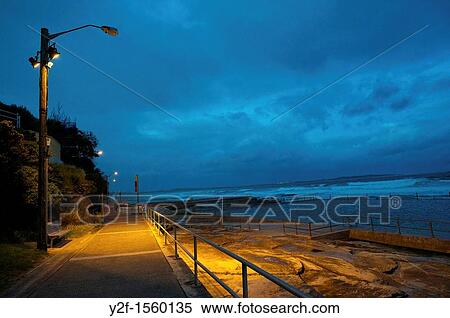 pathway at Conulla beach on stormy night View Large Photo Image Stock Photography - pathway at Conulla beach on stormy night. Fotosearch