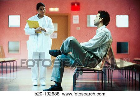 Stock Photo - Patient and nurse at waiting area of hospital. Fotosearch