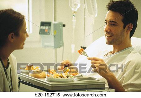 Stock Photography - Patient in hospital, lunchtime. Fotosearch