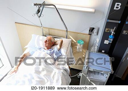 Stock Photo - patient in hospital room, Onkologikoa Hospital, Oncology Institute, Case Center for prevention, diagnosis and treatment of cancer, Donostia, San Sebastian, Gipuzkoa, Basque Country, Spain. Fotosearch