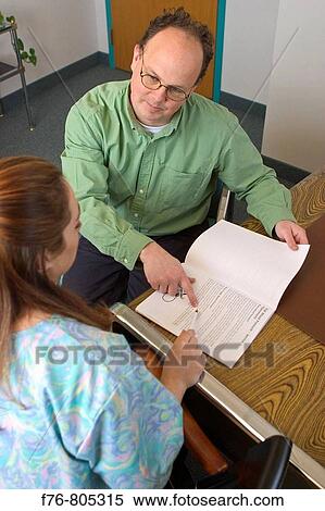 Patient, questioning medical instructions with technician View Large Photo Image Stock Photography - Patient, questioning medical instructions with technician. Fotosearch