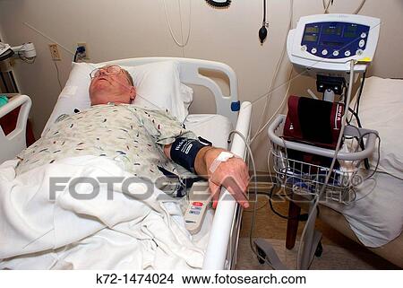 Patient recovering in hospital bed View Large Photo Image Picture - Patient recovering in hospital bed. Fotosearch