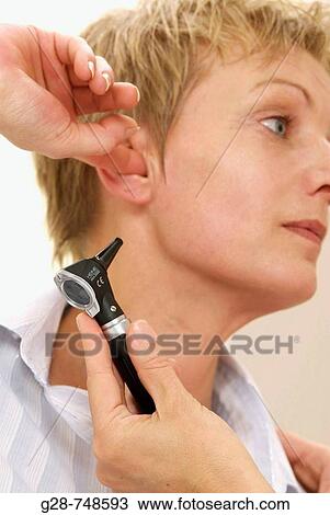 Patient with hearing problems, examined by otorhinolaryngologist View Large Photo Image Stock Image - Patient with hearing problems, examined by otorhinolaryngologist. Fotosearch