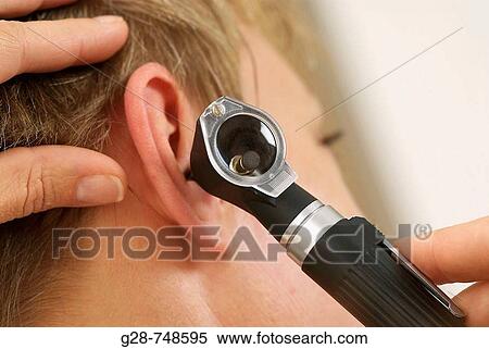 Patient with hearing problems, examined by otorhinolaryngologist View Large Photo Image Stock Photography - Patient with hearing problems, examined by otorhinolaryngologist. Fotosearch