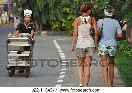 Pattaya (Thailand): a restaurant's chef and Russian tourists along the Walking Street View Large Photo Image Stock Photo - Pattaya (Thailand): a restaurant's chef and Russian tourists along the Walking Street. Fotosearch