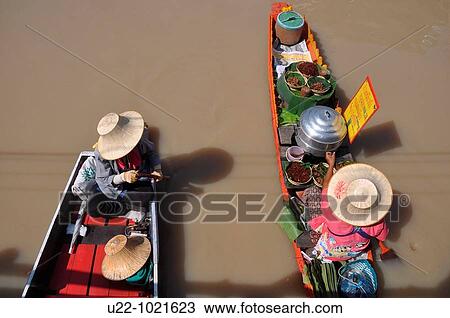 Stock Image - Pattaya (Thailand): canoes at the local Floating Market. Fotosearch