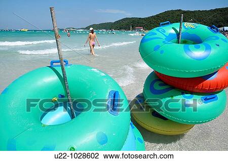 Pattaya (Thailand), rubber rings at Ta Waen beach, in Koh Larn island View Large Photo Image Stock Image - Pattaya (Thailand), rubber rings at Ta Waen beach, in Koh Larn island. Fotosearch