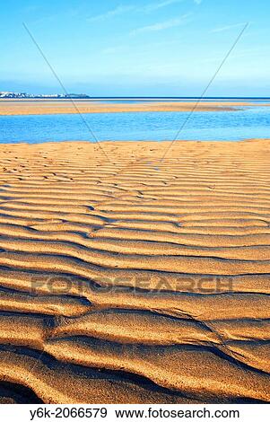 patterns in the sand left by the tide on a beach in cornwall, england, uk. View Large Photo Image Stock Photo - patterns in the sand left by the tide on a beach in cornwall, england, uk.. Fotosearch