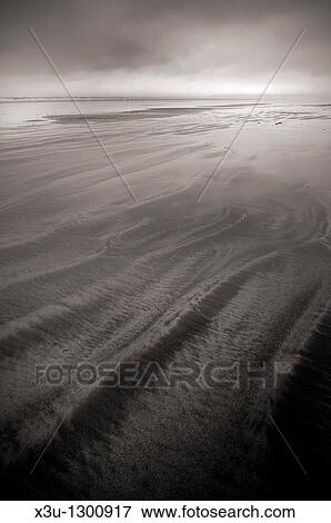 Patterns left in the sand by the retreating tide at Westward Ho!, Devon, England, United Kingdom View Large Photo Image Stock Photo - Patterns left in the sand by the retreating tide at Westward Ho!, Devon, England, United Kingdom. Fotosearch