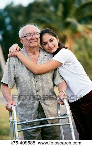 Pausing to hug grandpa View Large Photo Image Stock Photo - Pausing to hug grandpa. Fotosearch