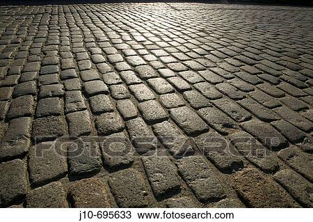 Stock Image - Paving stones with sun reflected, South Boston, MA, USA. Fotosearch