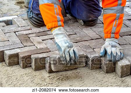 paviour at work in street in the Netherlands View Large Photo Image Picture - paviour at work in street in the Netherlands. Fotosearch