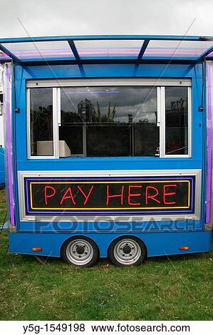 pay here sign notice at fun fair ride booth View Large Photo Image Stock Photo - pay here sign notice at fun fair ride booth. Fotosearch