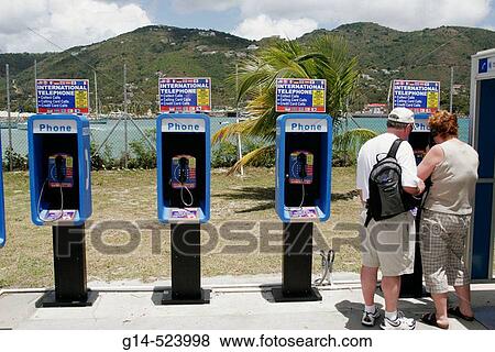 Pay phone, international telephone, couple. Road Town. Tortola. British Virgin Islands. View Large Photo Image Stock Photo - Pay phone, international telephone, couple. Road Town. Tortola. British Virgin Islands.. Fotosearch