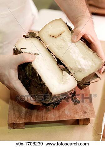 Pecorino Cheese being cut up and served at the cacioteka of Leonardo Spulcia, an Umbrian Delicatessan shop in Perugia, Italy View Large Photo Image Stock Photo - Pecorino Cheese being cut up and served at the cacioteka of Leonardo Spulcia, an Umbrian Delicatessan shop in Perugia, Italy. Fotosearch