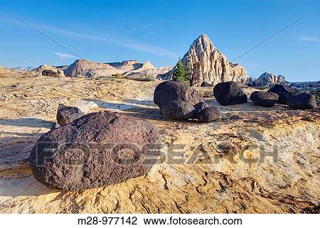 Pectols Pyramid with lava blouders in the foreground, Capitol Reef National Park Utah View Large Photo Image Stock Image - Pectols Pyramid with lava blouders in the foreground, Capitol Reef National Park Utah. Fotosearch