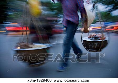 Stock Image - peddler Hanoi, Vietnam. Fotosearch