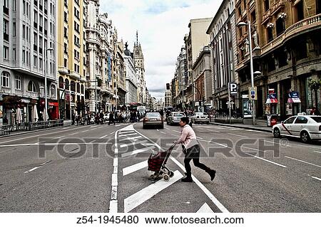 Pedestrian crossing the Gran Via street, Madrid, Spain. View Large Photo Image Stock Image - Pedestrian crossing the Gran Via street, Madrid, Spain.. Fotosearch