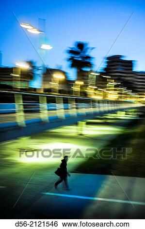 Pedestrian walking along a bike lane under the Flowers Bridge, old river bed Turia, Valencia, Spain View Large Photo Image Stock Photograph - Pedestrian walking along a bike lane under the Flowers Bridge, old river bed Turia, Valencia, Spain. Fotosearch