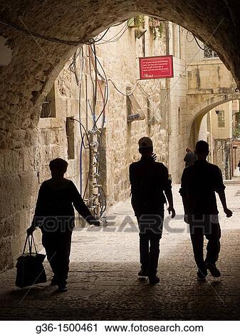 Stock Image - Pedestrians in the Old City in Jerusalem, Israel. Fotosearch