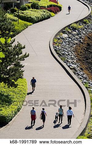 pedestrians walk on the path on the south side of False Creek, Vancouver, BC, Canada. View Large Photo Image Stock Photo - pedestrians walk on the path on the south side of False Creek, Vancouver, BC, Canada.. Fotosearch