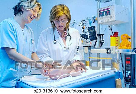 Pediatrician and nurse examinating baby at hospital View Large Photo Image Stock Image - Pediatrician and nurse examinating baby at hospital. Fotosearch