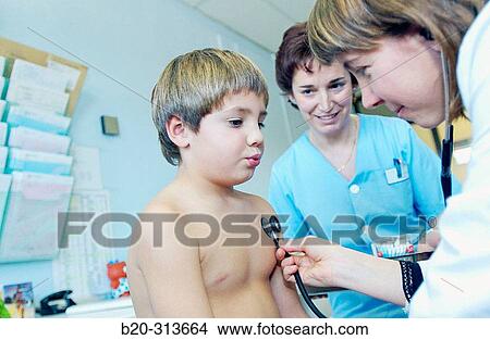 Pediatrician examinating 6 year old boy at pediatrics section of hospital View Large Photo Image Picture - Pediatrician examinating 6 year old boy at pediatrics section of hospital. Fotosearch