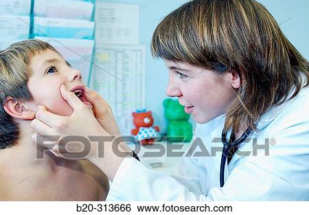 Pediatrician examinating 6 year old boy at pediatrics section of hospital View Large Photo Image Stock Photograph - Pediatrician examinating 6 year old boy at pediatrics section of hospital. Fotosearch