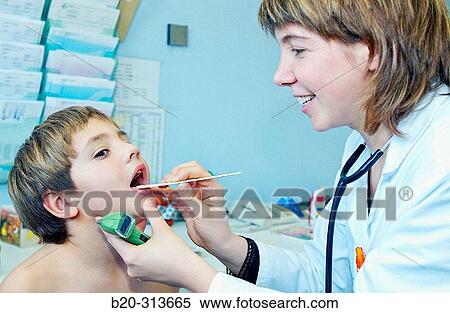 Stock Photography - Pediatrician examinating 6 year old boy at pediatrics section of hospital. Fotosearch