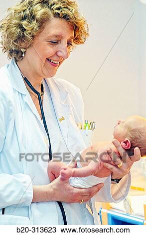 Pediatrician examinating baby at hospital View Large Photo Image Stock Image - Pediatrician examinating baby at hospital. Fotosearch