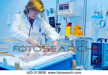 Stock Photo - Pediatrician examinating baby at hospital. Fotosearch