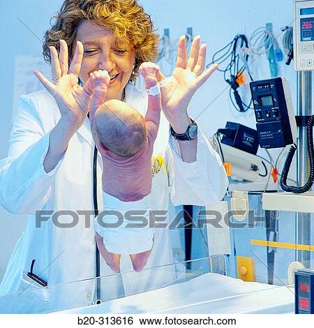 Pediatrician examinating baby at hospital View Large Photo Image Stock Photograph - Pediatrician examinating baby at hospital. Fotosearch