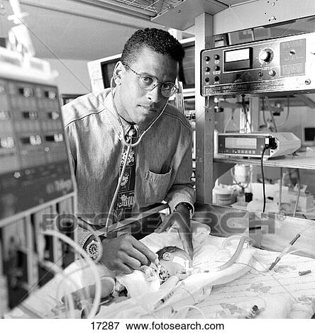 Pediatrician examining newborn baby View Large Photo Image Stock Photo - Pediatrician examining newborn baby. Fotosearch