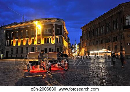 pedicab on Dome Square by night, Old Town, Riga, Latvia, Baltic region, Northern Europe View Large Photo Image Stock Image - pedicab on Dome Square by night, Old Town, Riga, Latvia, Baltic region, Northern Europe. Fotosearch
