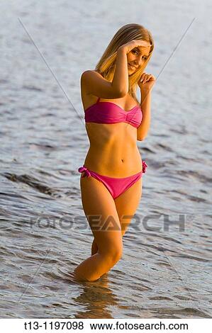 Peeking under hand young woman in water View Large Photo Image Stock Photo - Peeking under hand young woman in water. Fotosearch