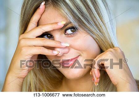 Peeping eye young woman portrait View Large Photo Image Stock Photo - Peeping eye young woman portrait. Fotosearch