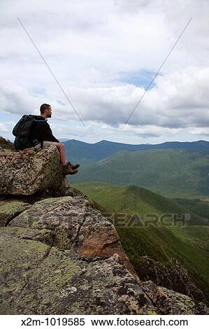 Pemigewasset Wilderness - A hiker on the summit of Bondcliff during the summer months Located in the White Mountains, New Hampshire USA View Large Photo Image Stock Photography - Pemigewasset Wilderness - A hiker on the summit of Bondcliff during the summer months Located in the White Mountains, New Hampshire USA. Fotosearch