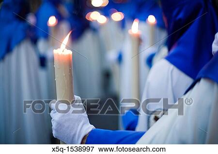 Penitents bearing candles, Holy Week 2008, Seville, Spain View Large Photo Image Stock Photo - Penitents bearing candles, Holy Week 2008, Seville, Spain. Fotosearch