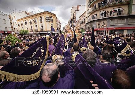 Penitents to playing their trumpets in a Holy week procession to the Nazarene, Holy Friday, Linares, Jaen province, Spain. View Large Photo Image Stock Image - Penitents to playing their trumpets in a Holy week procession to the Nazarene, Holy Friday, Linares, Jaen province, Spain.. Fotosearch