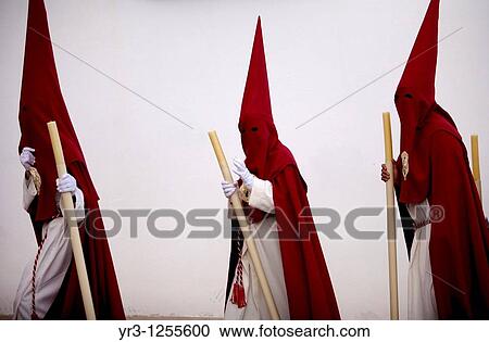 Penitents walk in a street during Easter Holy Week celebrations in Espera village, Cadiz province, Andalusia, Spain. View Large Photo Image Stock Image - Penitents walk in a street during Easter Holy Week celebrations in Espera village, Cadiz province, Andalusia, Spain.. Fotosearch