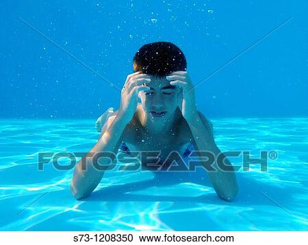 Stock Image - Pensive boy underwater. Fotosearch